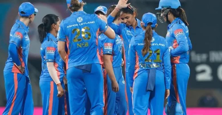 Mumbai Indians Women celebrating after taking a wicket