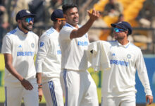 R Ashwin and Indian players celebrating after taking a wicket in a test match