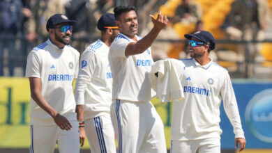 R Ashwin and Indian players celebrating after taking a wicket in a test match