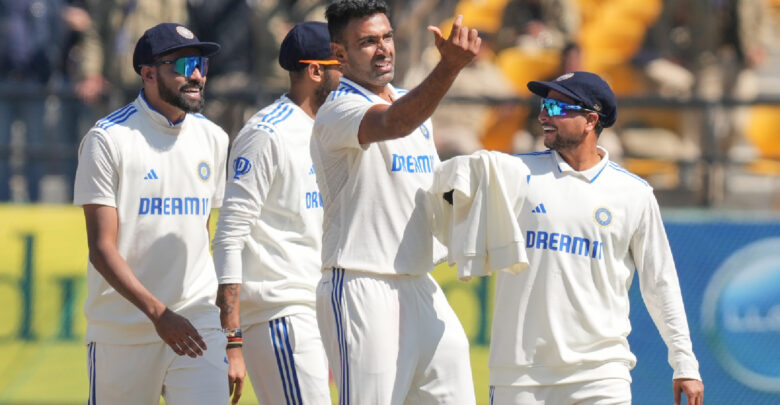 R Ashwin and Indian players celebrating after taking a wicket in a test match