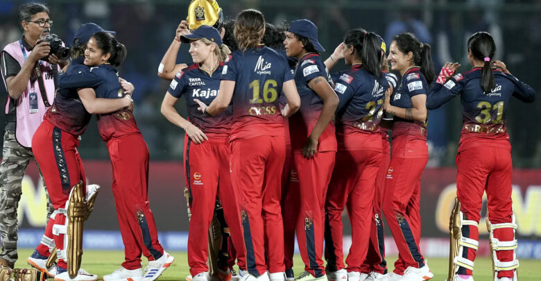 RCB women players celebrating after winning WPL final 2024