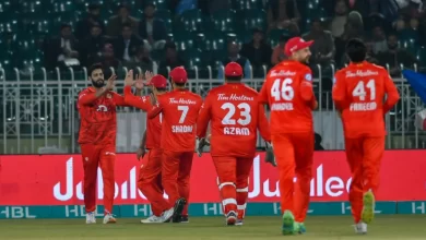 Islamabad United players celebrating after taking a wicket against Karachi Kings in a PSL 2024 match.