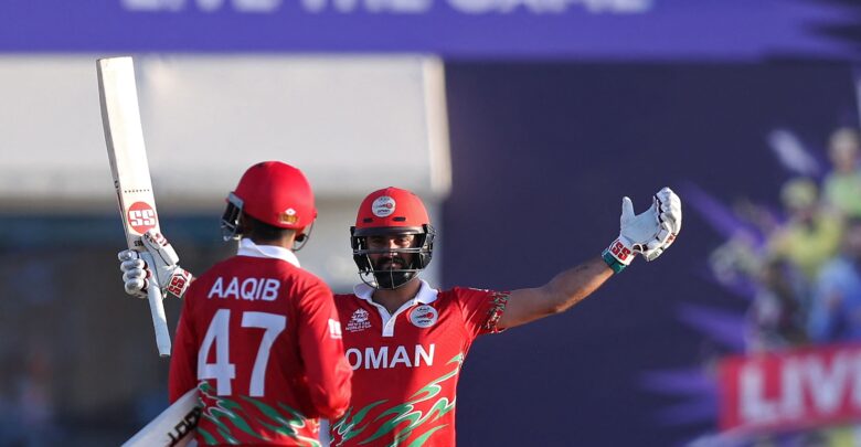 Aaqib Ilyas of Oman celebrating his knock that secured their spot in the final