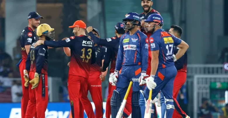 RCB player celebrating after taking a wicket in a match against LSG.