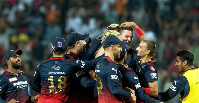 RCB player celebrating after a wicket in IPL 2024"; Title Text: "RCB Player