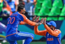 Axar Patel and Rohit Sharma celebrate taking a wicket during their T20 World Cup semi-final against England