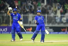 Rahmanullah Gurbaz raises his bat after scoring a century against South Africa in the second ODI.