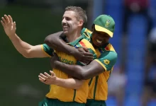 Anrich Nortje celebrates taking a crucial wicket during a Champions Trophy match.