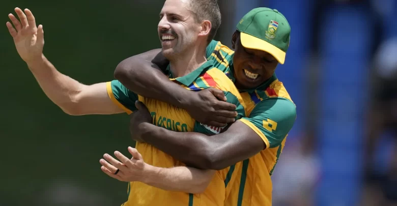 Anrich Nortje celebrates taking a crucial wicket during a Champions Trophy match.