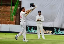 Sean Williams raising his bat after scoring a century in the first Test