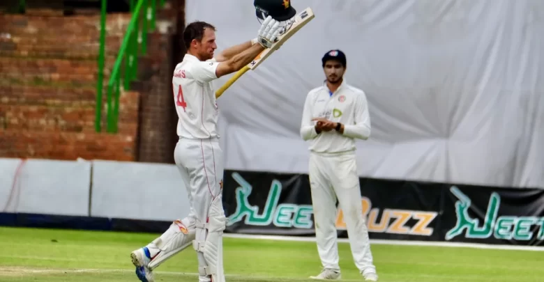 Sean Williams raising his bat after scoring a century in the first Test