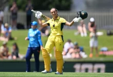 Ashleigh Gardner celebrates her maiden ODI century against England in Hobart.