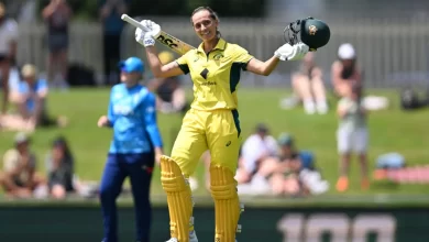 Ashleigh Gardner celebrates her maiden ODI century against England in Hobart.