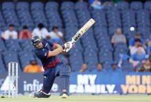 Andries Gous raises his bat after scoring a half-century against Namibia in WCL 2