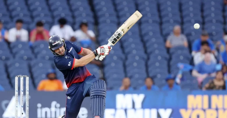 Andries Gous raises his bat after scoring a half-century against Namibia in WCL 2