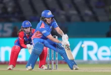 Nat Sciver-Brunt celebrates her half-century, leading Mumbai Indians to victory in WPL 2025.