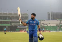 Ibrahim Zadran celebrates after scoring a record-breaking 177 runs against England in an ICC ODI match.