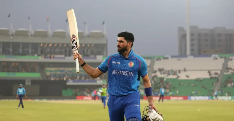 Ibrahim Zadran celebrates after scoring a record-breaking 177 runs against England in an ICC ODI match.