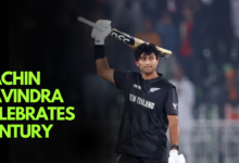 Rachin Ravindra celebrates his century as New Zealand qualifies for the Champions Trophy semifinals.