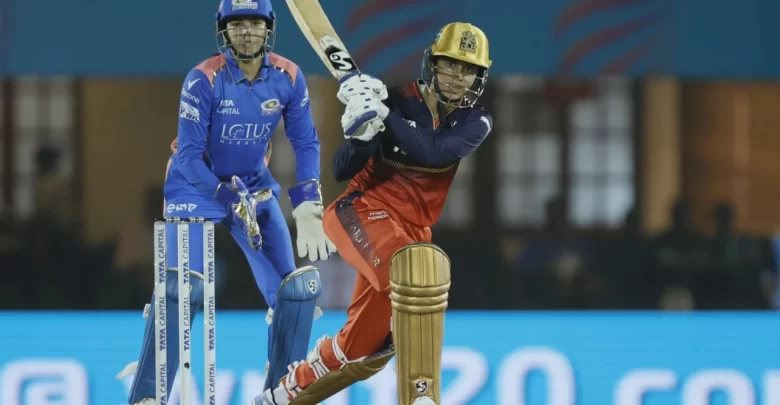 Smriti Mandhana celebrates her explosive half-century for RCB in WPL 2025.