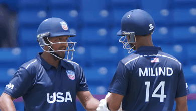 Smit Patel raises his bat after scoring a maiden international century for USA against Canada