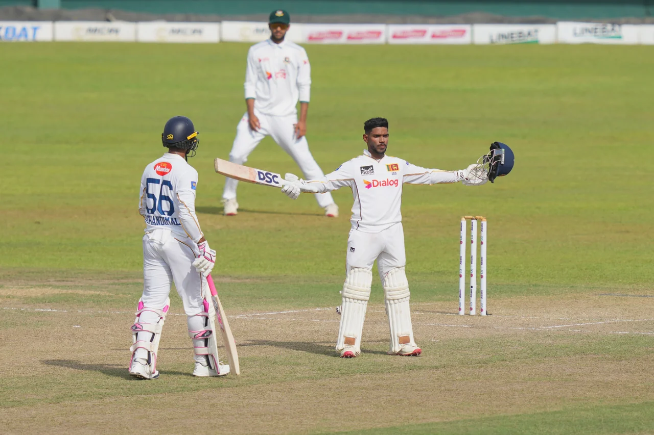 pathum nissanka raises bat after scoring century against bangladesh