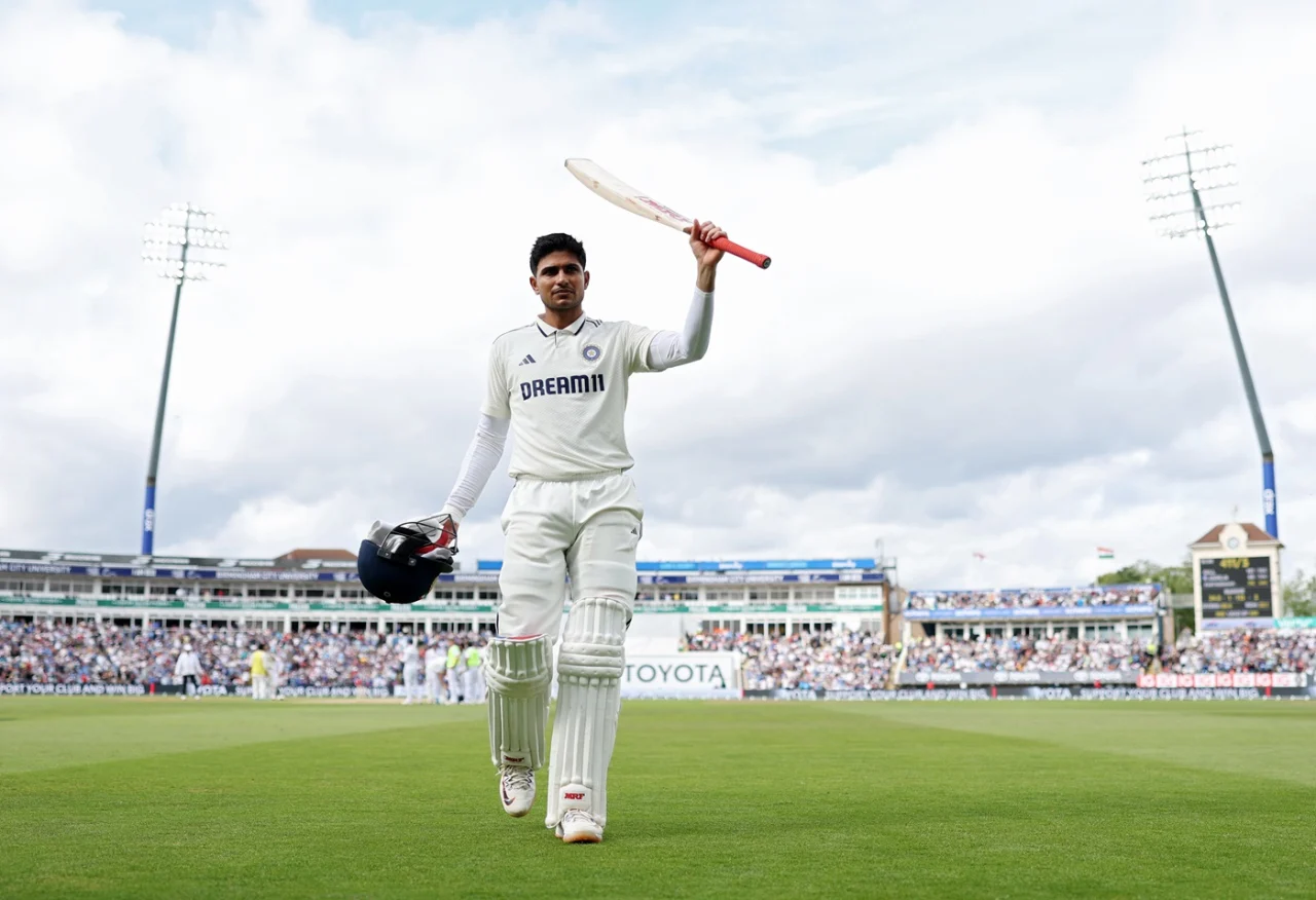 shubman gill raises his bat after scoring a double century against england